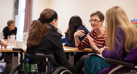 Disabled women in discussion.