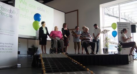Trustees and volunteers on stage