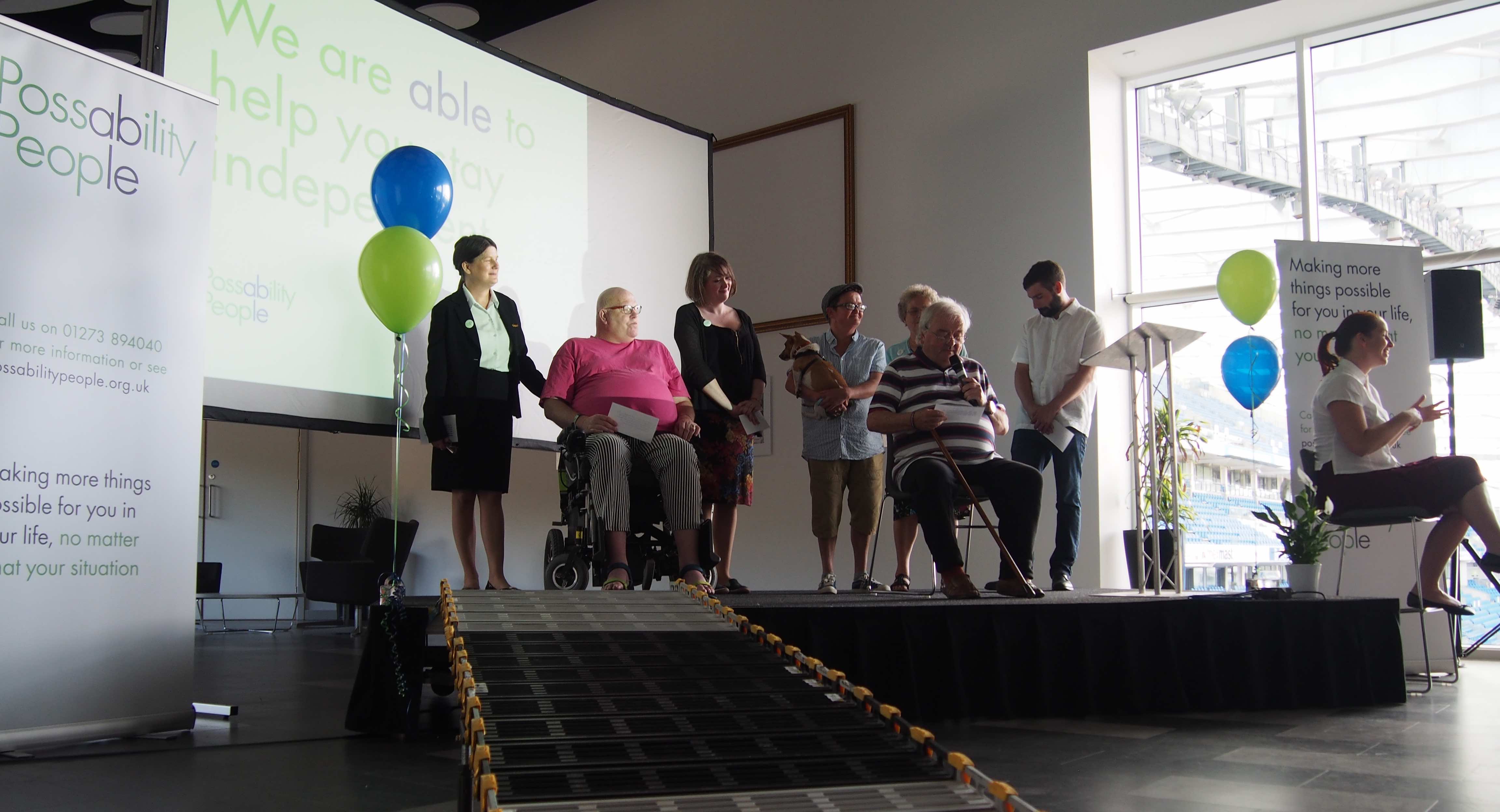 Trustees and volunteers on stage